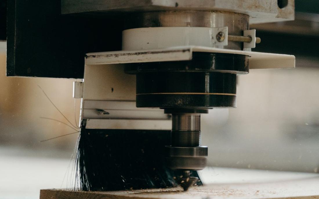 A CNC router cutting a profile directly — no mold tooling required